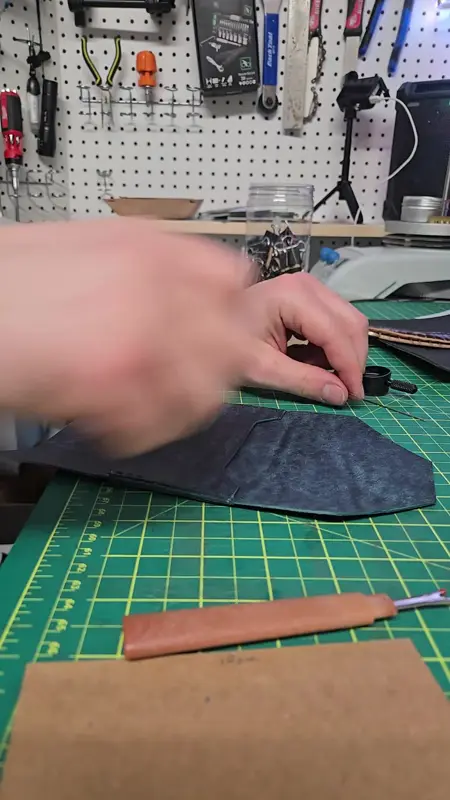 Pattern work on an indigo panel — Rogue Artisan leather workshop, East Vancouver