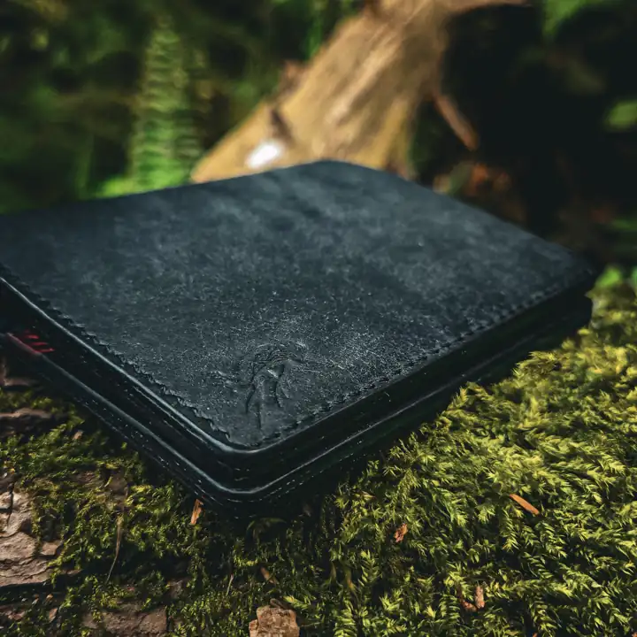 Black bifold in low forest light — Rogue Artisan, East Vancouver